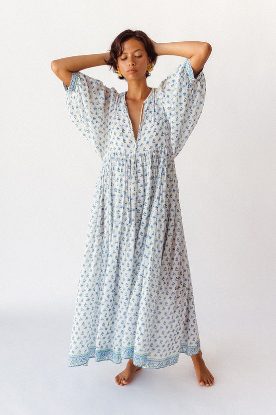 Daughters of India Kyra Maxi Dress in Azure — studio arms behind head, full length blue floral block print cotton