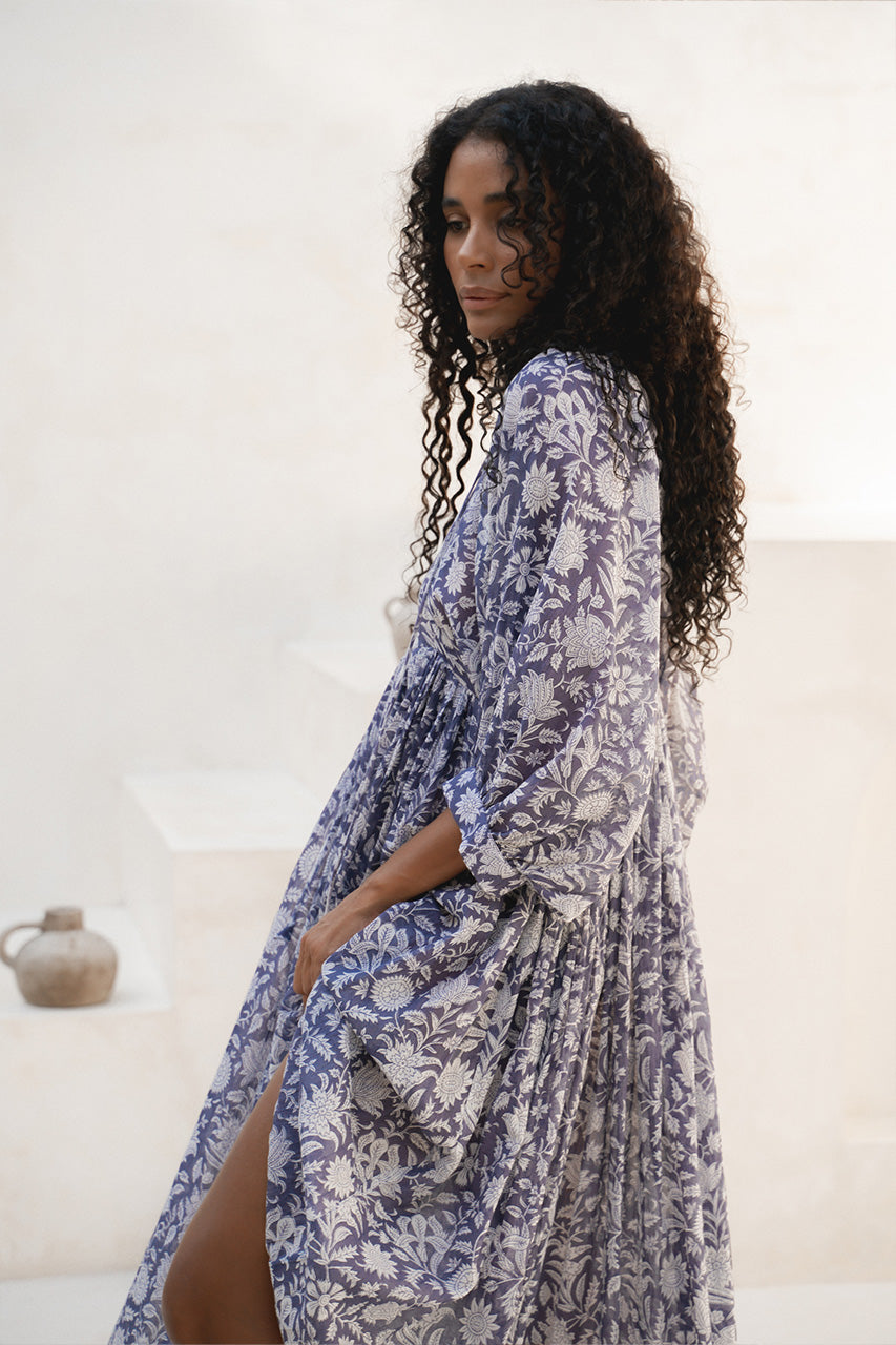 Kyra Midi Dress Blue Iris — full length over-shoulder lifestyle shot, hand block print floral cotton | Daughters of India