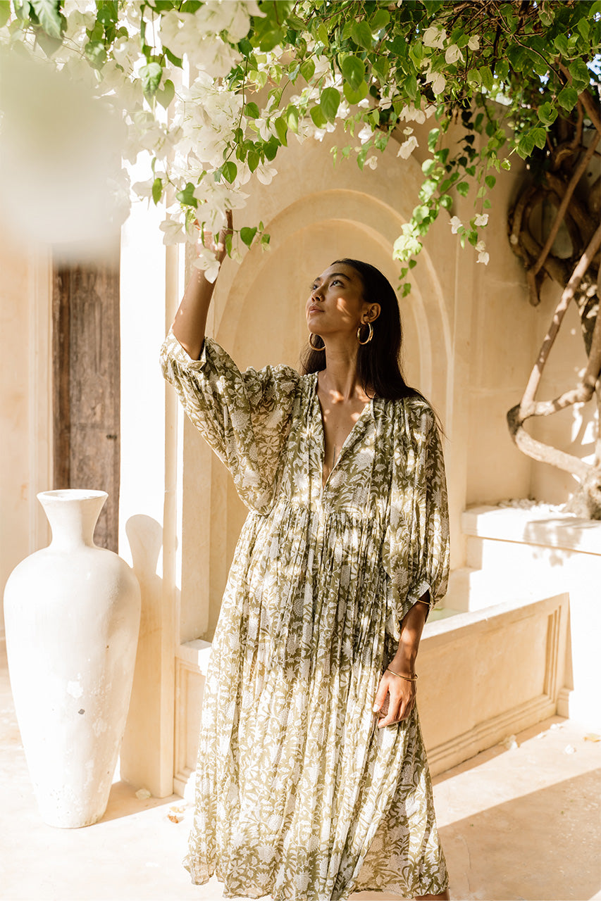 Daughters of India Kyra Midi Dress in Olive — reaching for bougainvillea by arched villa wall, hand screen print cotton