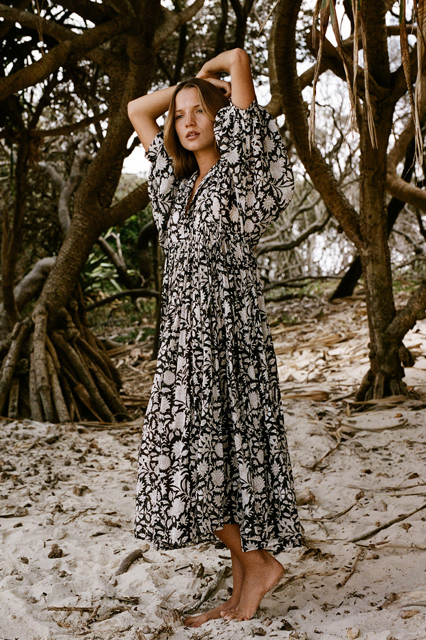 Daughters of India Kyra Midi Dress in Pepper — model on mangrove beach, hand screen print cotton