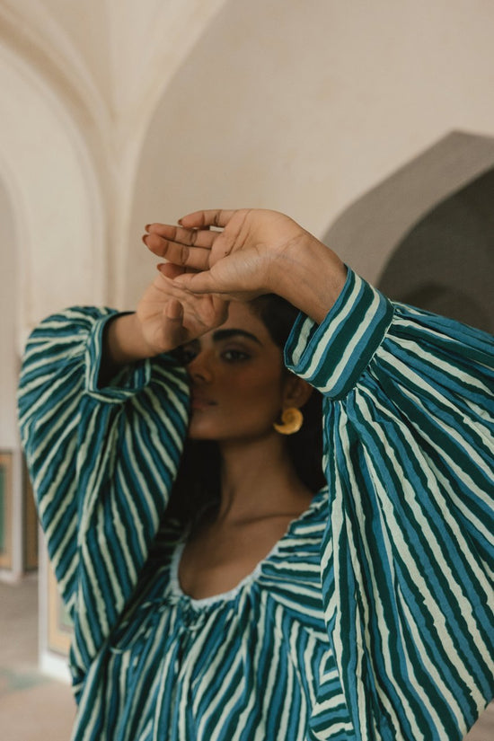 Ria Blouse Cyan Candy — neckline detail close-up, model showing gathered neckline and relaxed shoulder of cyan and dark stripe hand block print cotton blouse, artisan Jaipur India | Daughters of India