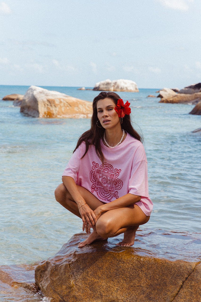 Shanti Tee Pink — close-up front view of red mandala logo print detail on pink oversized cotton tee, hand screen printed in India | Daughters of India
